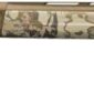 Camouflage-patterned hunting shotgun, side view.