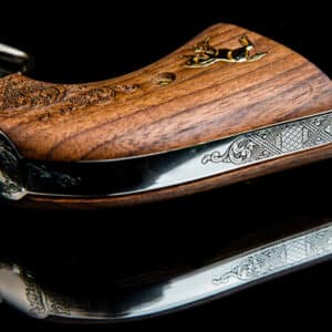 Decorative wooden and metal gun handle close-up