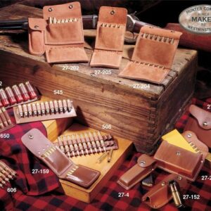 Leather ammo holders and shotgun shells displayed on crate.